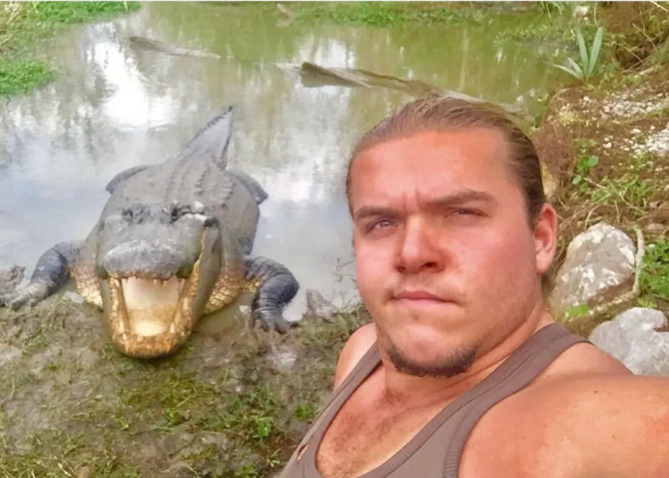 ZZ with an open-mouthed alligator